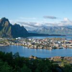 A breathtaking view of Svolvær, the largest town in the Lofoten archipelago, from the viewpoint Linken. The town is surrounded by dramatic mountains and the waters of the Vestfjorden.