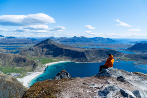 Hiker Enjoying the View Over Haukland and Vik Beaches from Veggen in Lofoten