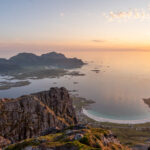 Sunset view over Ramberg Beach from the summit of Moltinden in Lofoten, Norway.